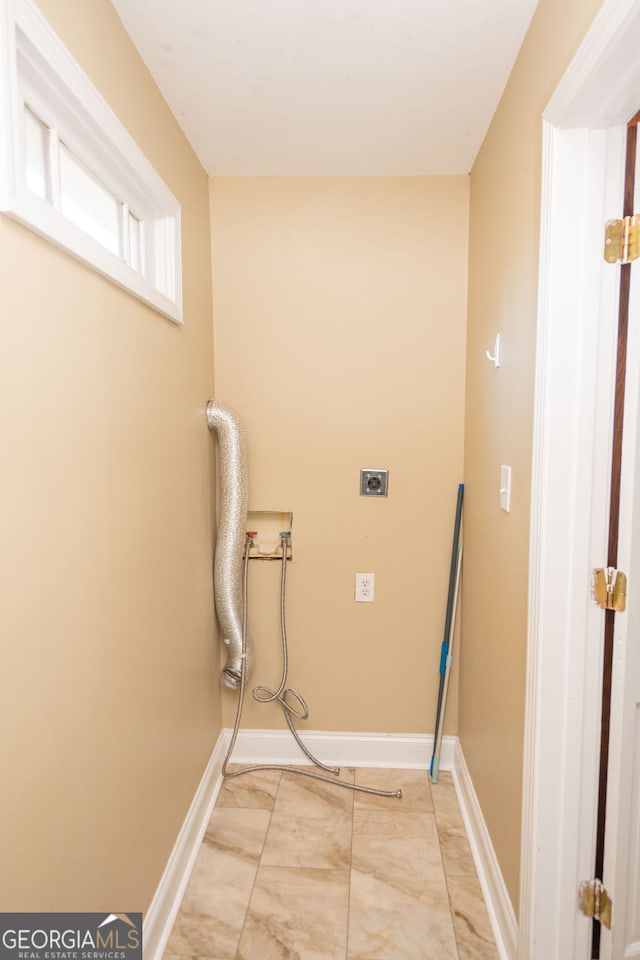 clothes washing area with electric dryer hookup and hookup for a washing machine