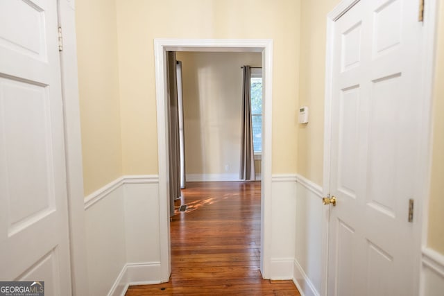 hall with dark hardwood / wood-style flooring