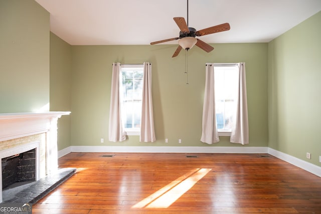 unfurnished living room with hardwood / wood-style floors and ceiling fan