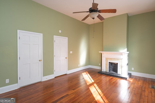 unfurnished living room featuring ceiling fan and wood-type flooring