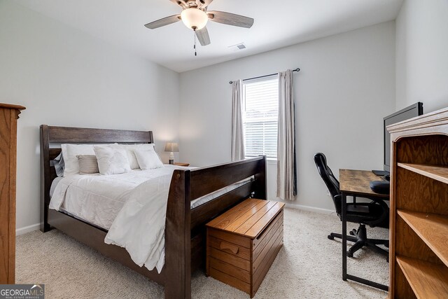 bedroom with light colored carpet and ceiling fan