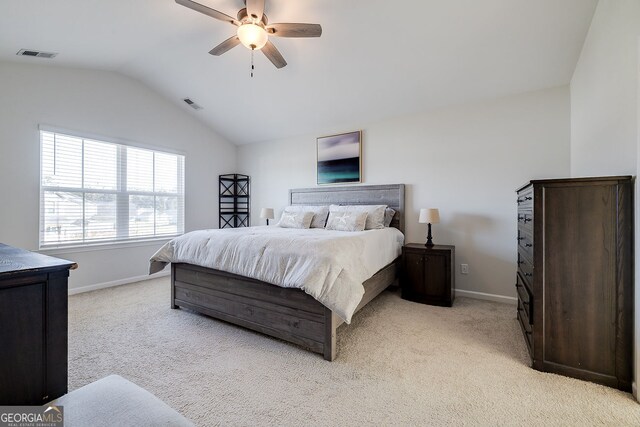 bedroom with light carpet, ceiling fan, and lofted ceiling