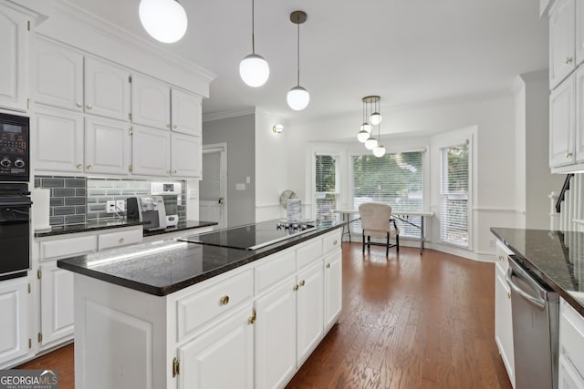 kitchen featuring white cabinetry, black appliances, dark hardwood / wood-style floors, decorative light fixtures, and a kitchen island