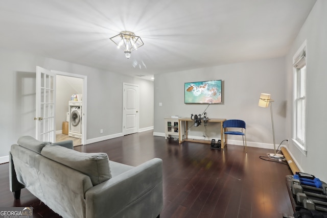 living room with hardwood / wood-style flooring, french doors, a healthy amount of sunlight, and washer / clothes dryer