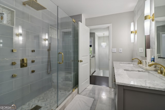 bathroom featuring an enclosed shower and vanity