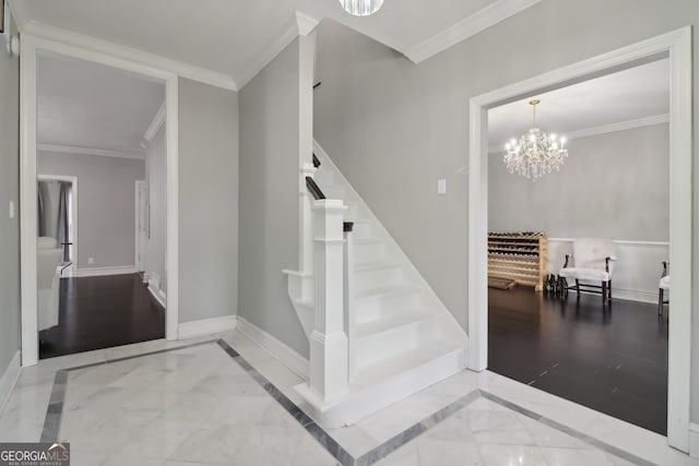 stairway featuring hardwood / wood-style floors, a notable chandelier, and ornamental molding