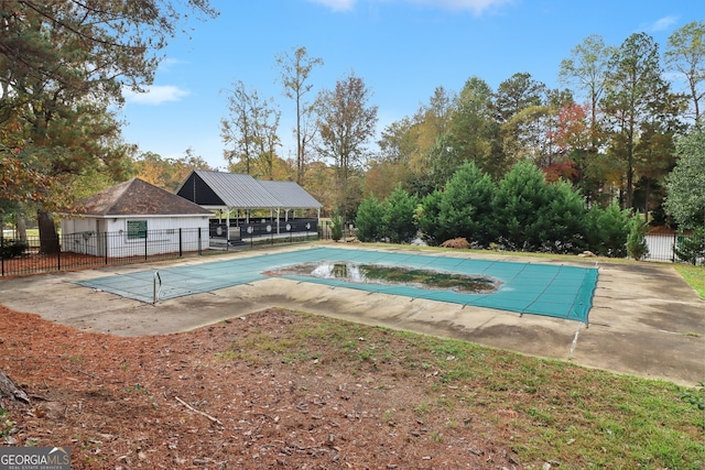 view of swimming pool with a patio