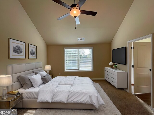 carpeted bedroom with vaulted ceiling and ceiling fan