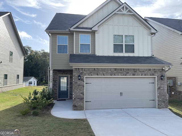 craftsman house featuring a front yard and a garage