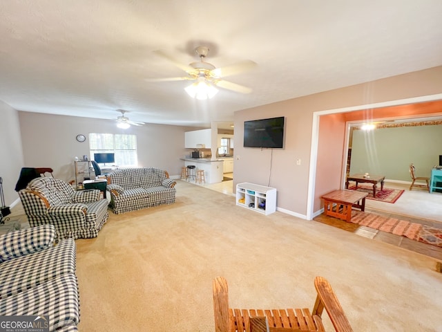 living room featuring carpet flooring and ceiling fan