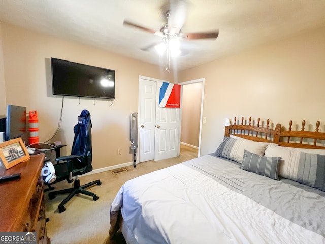 bedroom with light colored carpet and ceiling fan