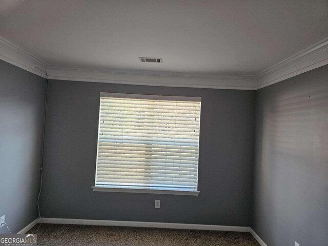 carpeted empty room with ornamental molding