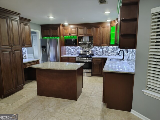 kitchen with sink, stainless steel appliances, ventilation hood, decorative backsplash, and a kitchen island