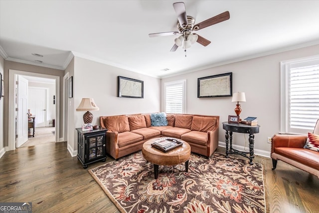 living room with ornamental molding, dark hardwood / wood-style flooring, and ceiling fan