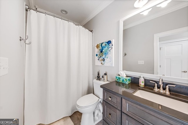 bathroom featuring vanity, toilet, and ornamental molding