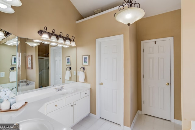 bathroom featuring tile patterned floors, vanity, and separate shower and tub