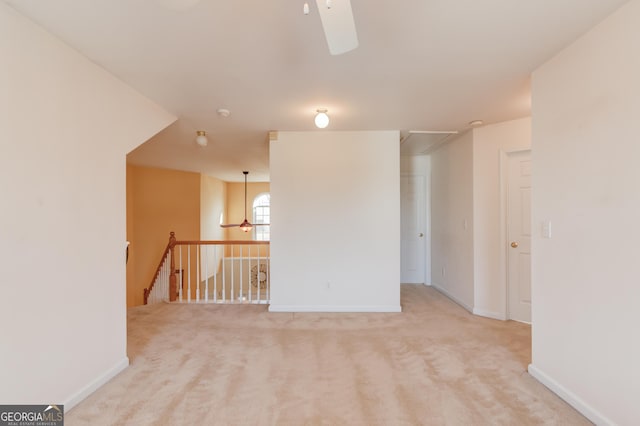 empty room featuring light colored carpet