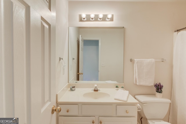 bathroom with vanity and toilet