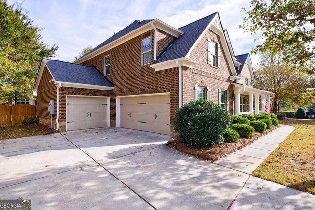 view of side of property featuring a garage