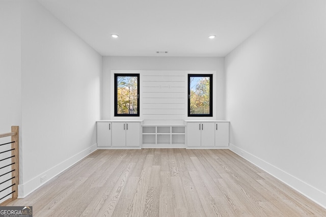 spare room with light hardwood / wood-style floors