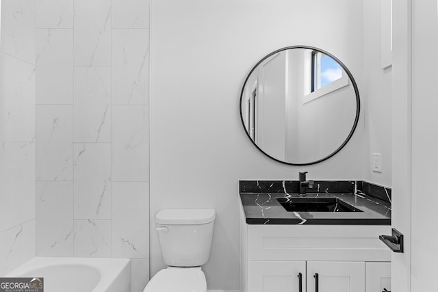 bathroom with vanity and toilet