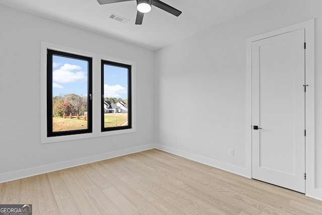 spare room featuring ceiling fan and light wood-type flooring