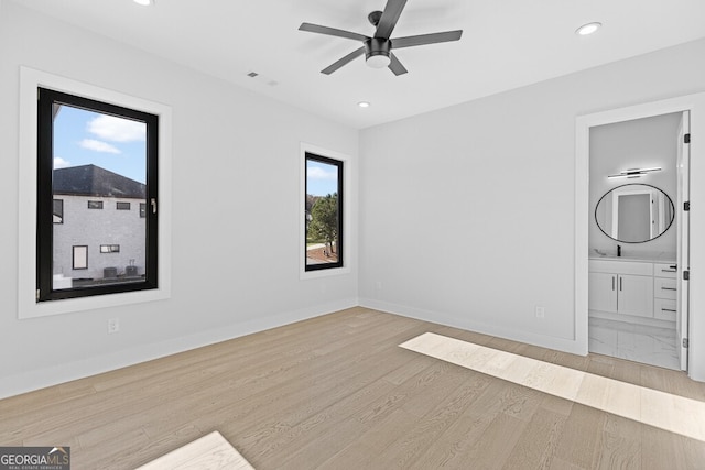 empty room with light hardwood / wood-style flooring and ceiling fan