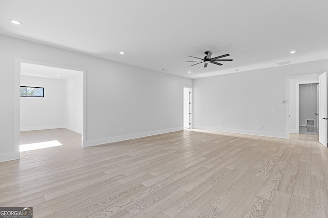 unfurnished living room with ceiling fan and light hardwood / wood-style floors