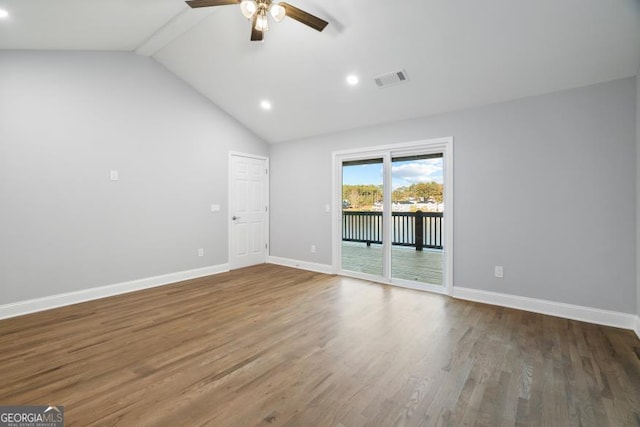 interior space featuring a ceiling fan, visible vents, baseboards, and wood finished floors