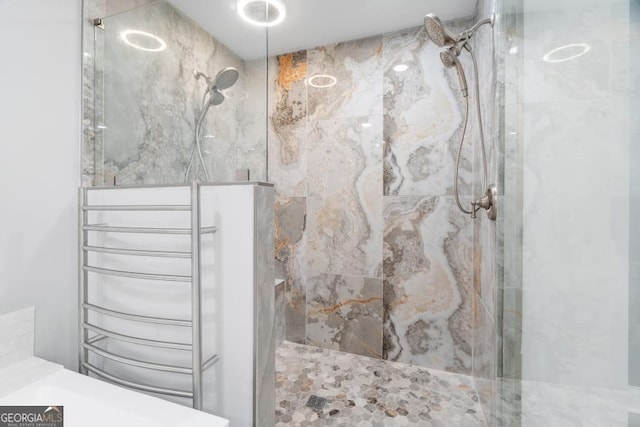 bathroom with a marble finish shower