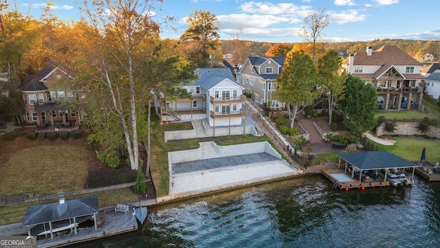 birds eye view of property featuring a water view and a residential view