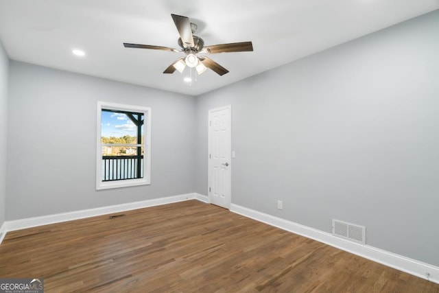 unfurnished room featuring recessed lighting, visible vents, a ceiling fan, wood finished floors, and baseboards