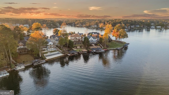 aerial view at dusk with a water view