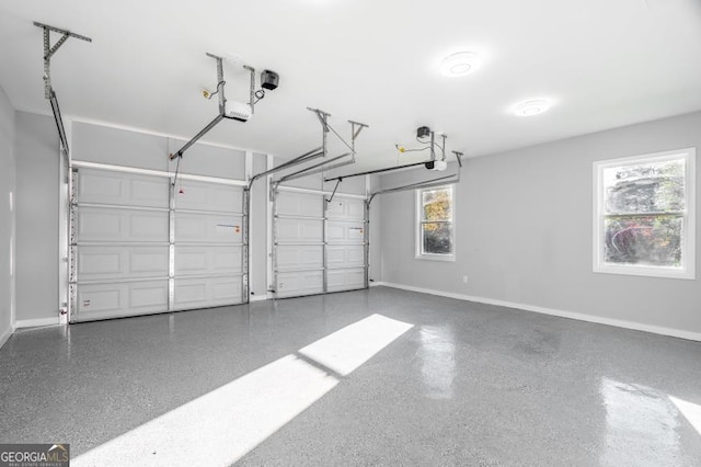 garage featuring baseboards and a garage door opener