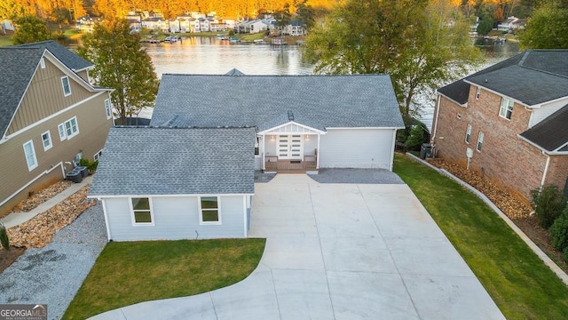 birds eye view of property with a water view