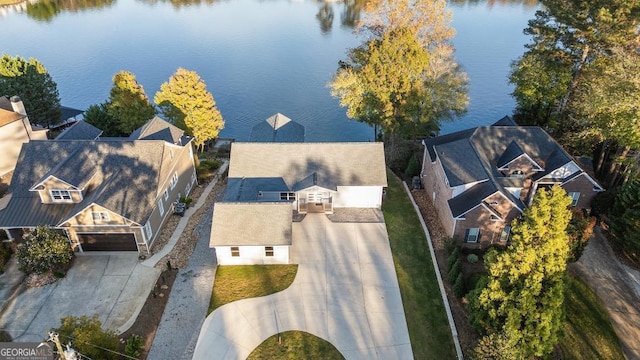 bird's eye view featuring a residential view and a water view