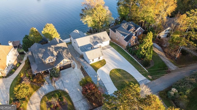 bird's eye view featuring a water view and a residential view