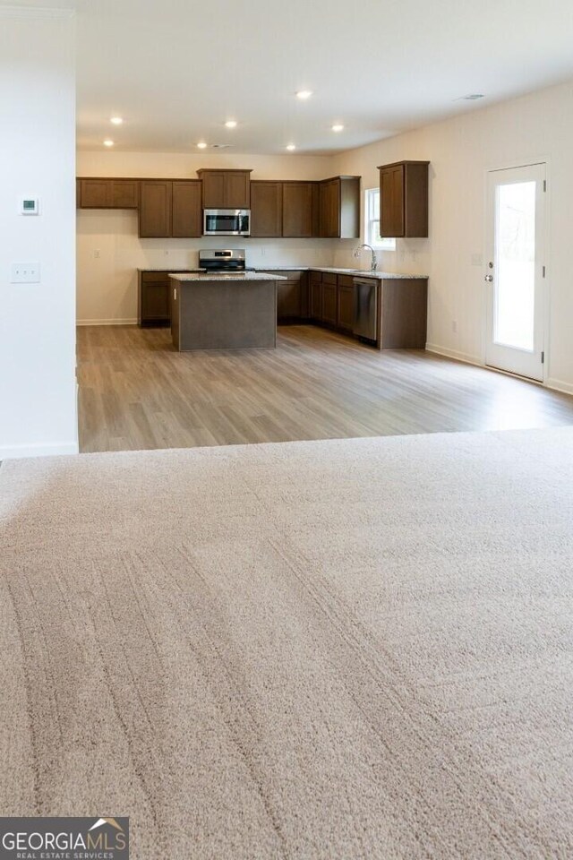 89 Hampton Ridge Way, Jefferson, GA 30549 - kitchen with appliances with stainless steel finishes, recessed lighting, a center island, baseboards, and a sink