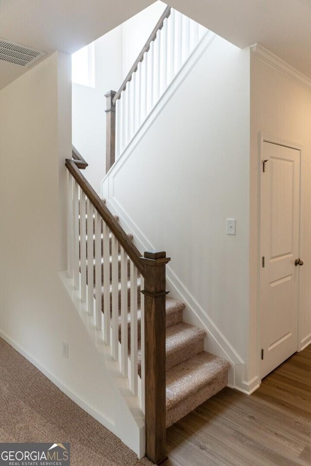 89 Hampton Ridge Way, Jefferson, GA 30549 - stairs featuring baseboards, crown molding, and wood finished floors
