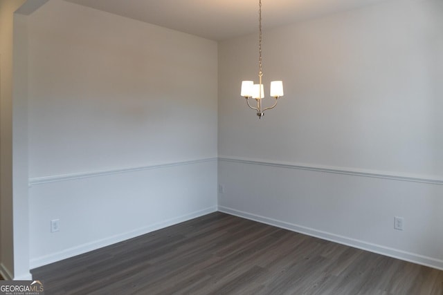 89 Hampton Ridge Way, Jefferson, GA 30549 - empty room with dark wood-style flooring, a chandelier, and baseboards