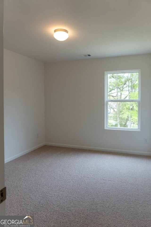 89 Hampton Ridge Way, Jefferson, GA 30549 - carpeted empty room with baseboards