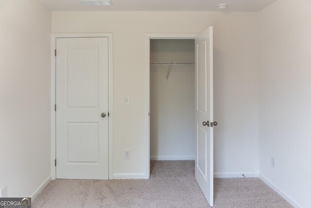 89 Hampton Ridge Way, Jefferson, GA 30549 - unfurnished bedroom featuring carpet floors, a closet, and baseboards