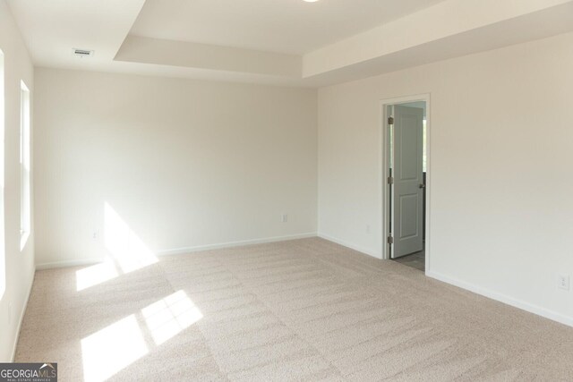 89 Hampton Ridge Way, Jefferson, GA 30549 - carpeted spare room with a tray ceiling and baseboards