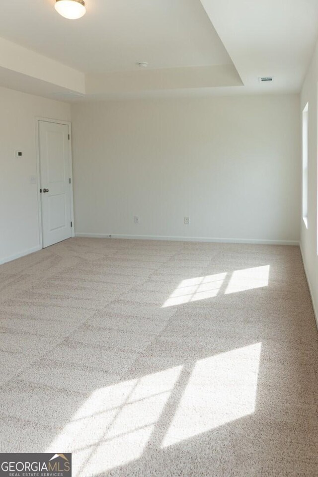 89 Hampton Ridge Way, Jefferson, GA 30549 - carpeted spare room featuring a tray ceiling and baseboards