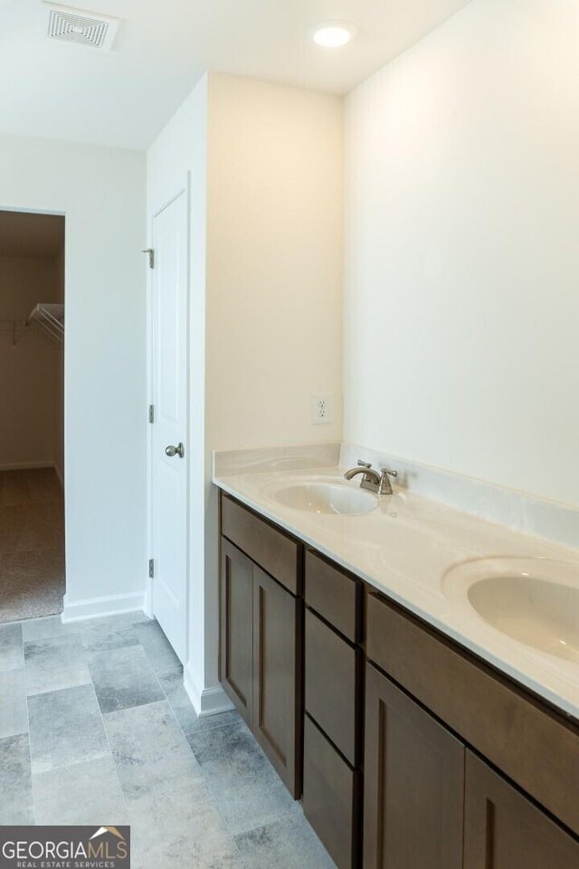 89 Hampton Ridge Way, Jefferson, GA 30549 - bathroom featuring a spacious closet and double vanity