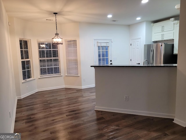 interior space with a chandelier and dark wood-type flooring