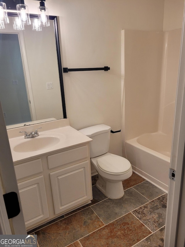 full bathroom with vanity, shower / bathtub combination, and toilet