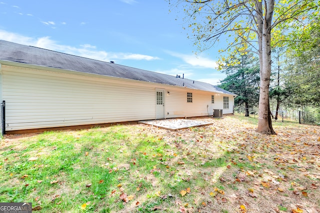 back of property with central AC