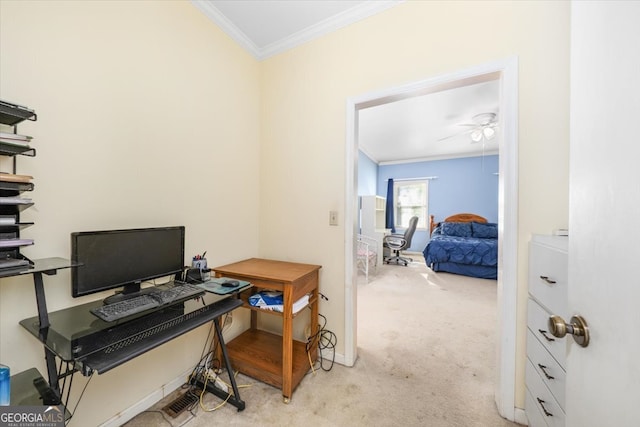 carpeted office space featuring ornamental molding and ceiling fan