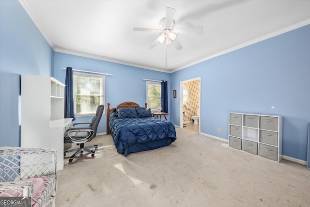 bedroom featuring ornamental molding, carpet, ensuite bath, and ceiling fan